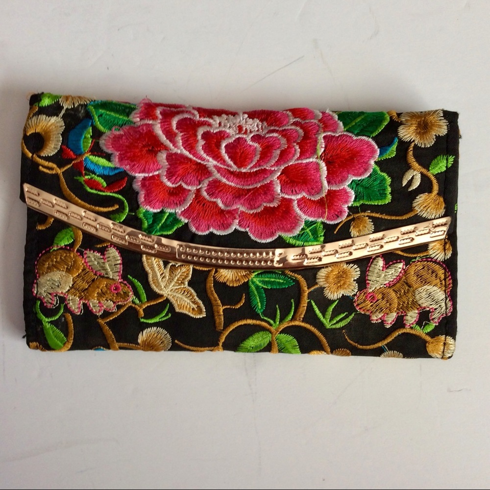 Embroidered bunny and carnation satin wallet.